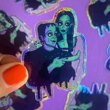 Load image into Gallery viewer, Big Eyed Lily Munster and Herman Munster Rainbow Glitter Water Bottle Sticker