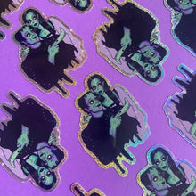 Load image into Gallery viewer, Big Eyed Lily Munster and Herman Munster Rainbow Glitter Water Bottle Sticker