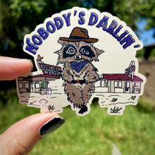 Load image into Gallery viewer, Cowboy Raccoon &quot;Nobody&#39;s Darlin&#39;&quot; Water Bottle Sticker
