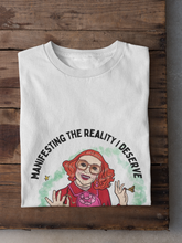 Load image into Gallery viewer, Gladys "Manifesting the Reality I Deserve"  Unisex Graphic Tee
